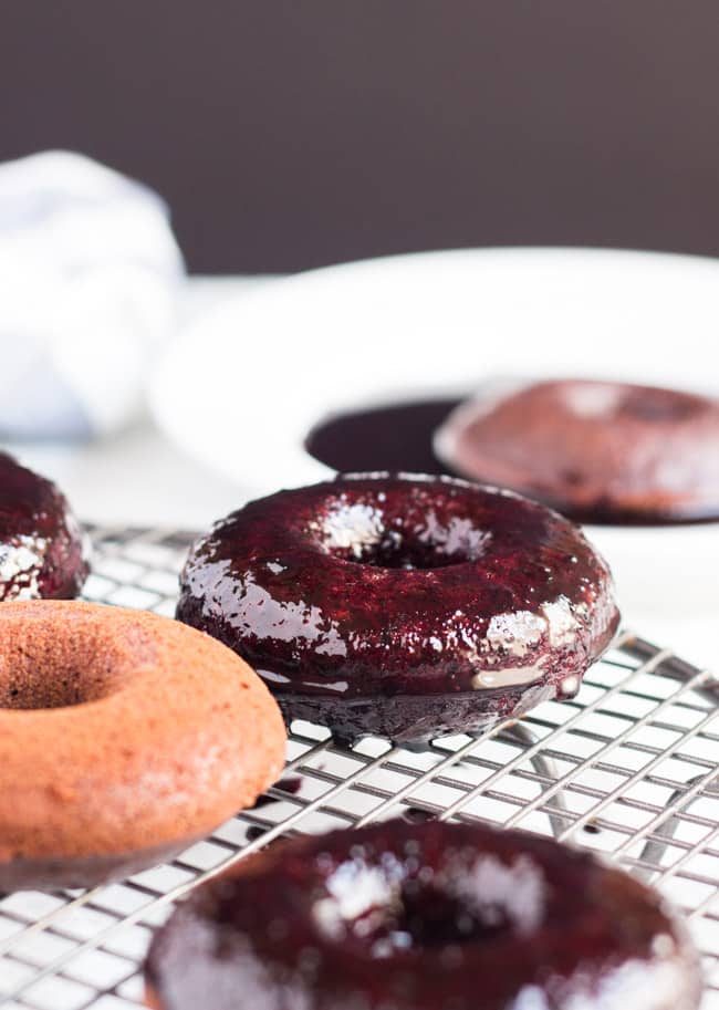Baked Berry Spelt Doughnuts are quick to make, packed full of berries, and are the perfect size to tuck into a lunchbox.