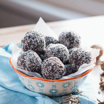 Chocolate Coconut Bliss Balls can be whipped up in ten minutes, and are perfect to keep in the fridge for a simple grab-&-go snack.