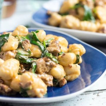 A cropped picture of a plate full of an easy gnocchi recipe.