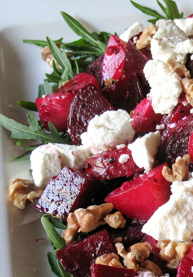 Close up shot of Roasted Beetroot Salad, with Goats Cheese & Walnuts, showing individual ingredients 