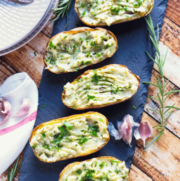 Roasted Garlic Twice Baked Potatoes are full of creamy, roasted garlic, and can easily be frozen so you always have a quick side dish on hand.