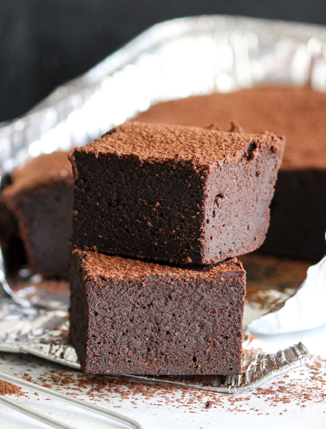 Chocolate & Guinness Spelt Brownies are the little black dress of the dessert department.  Dress them up or down depending on your needs. | thecookspyjamas.com
