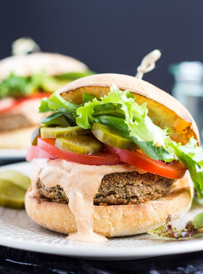 Spiced Chickpea Burgers, paired with smoky chipotle sour cream, are perfect for a quick vegetarian lunch or dinner. 