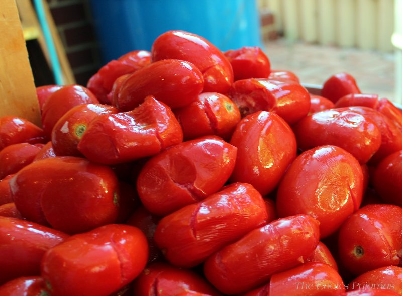 How To Make Tomato Passata: A close up shot of squashed tomatoes