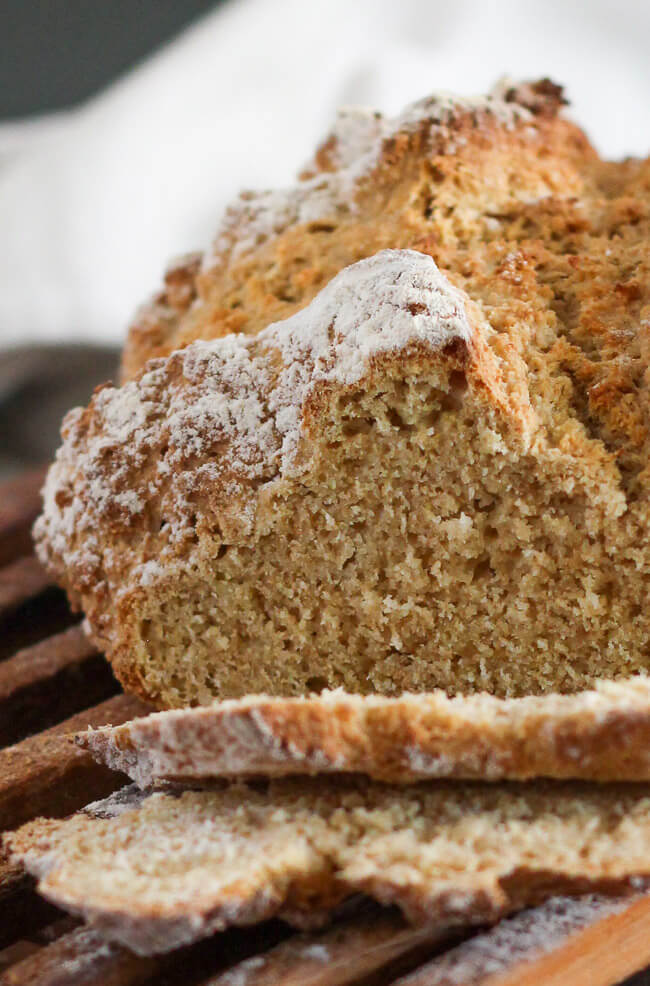 A close up shot of a cut loaf of traditional Irish soda bread showing the crumb structure of the loaf. 