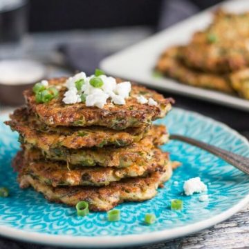 A stack of five zucchini & feta fritters, made with leftover quinoa.